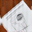 A notepad and pen with fabric sketches representing consultation